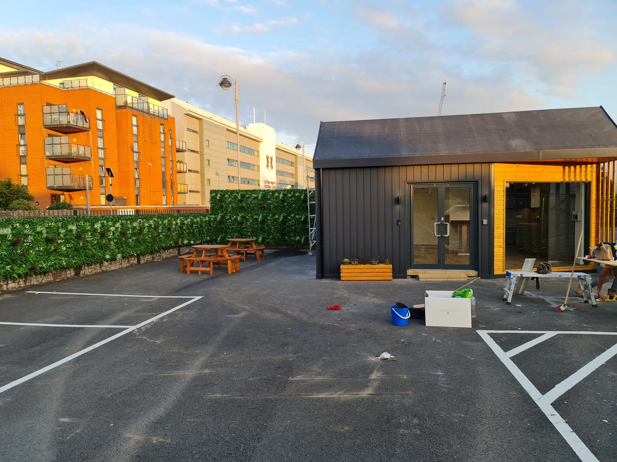 commercial car park next to yellow building
