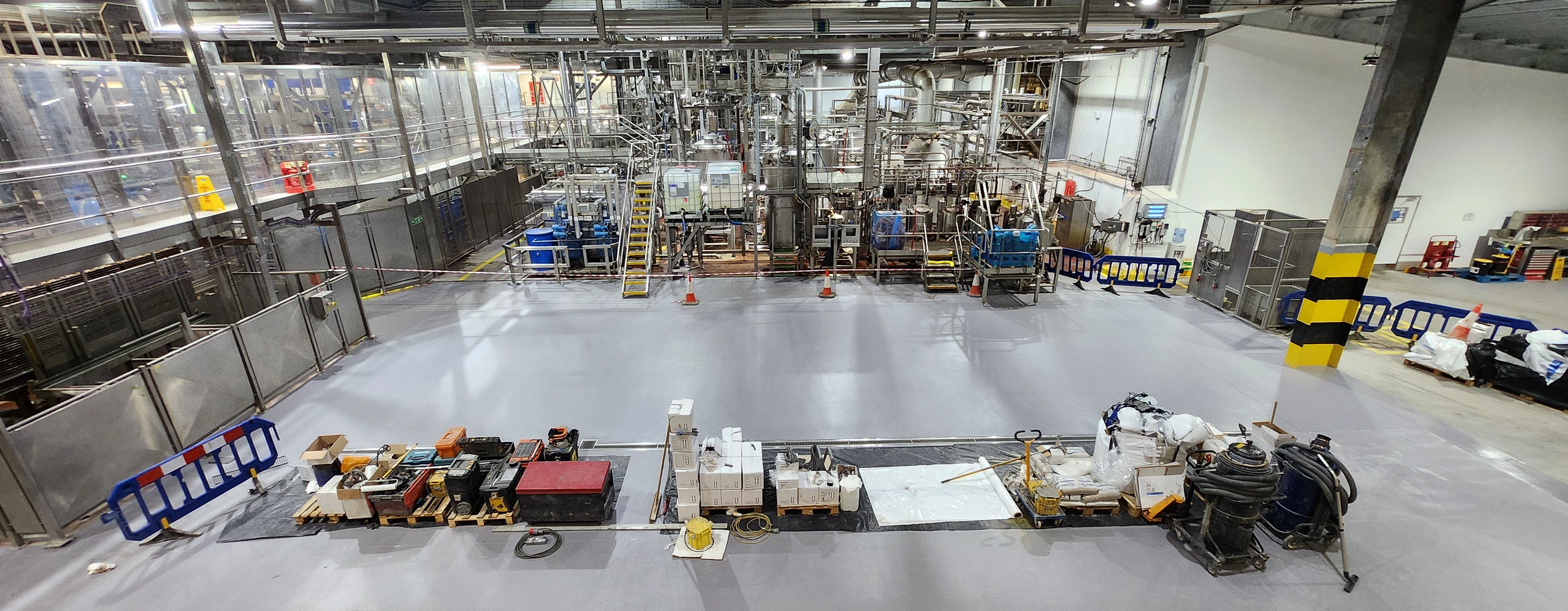 A factory with a lot of machinery inside of it.